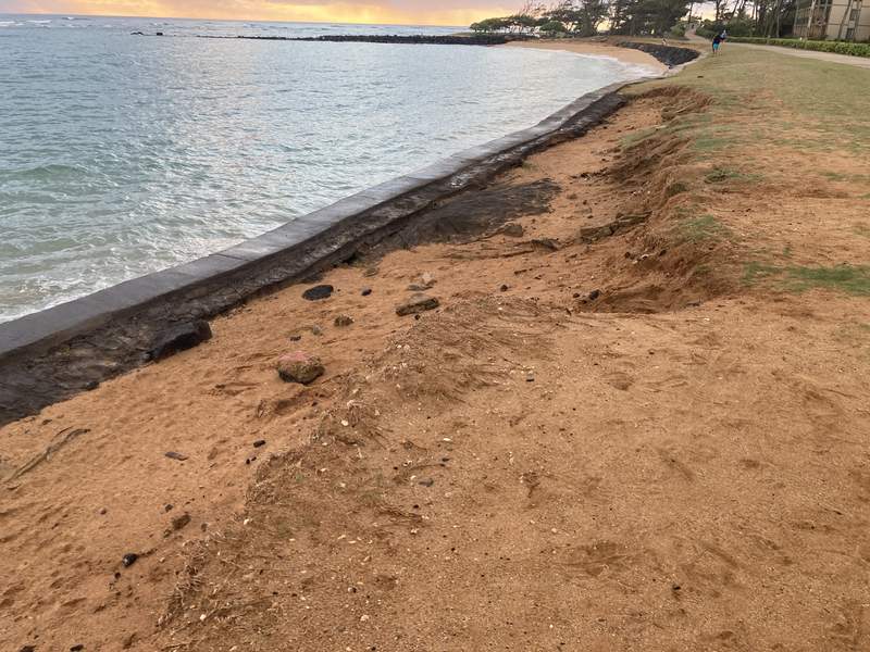 Seawall with erosion damage along beachfront